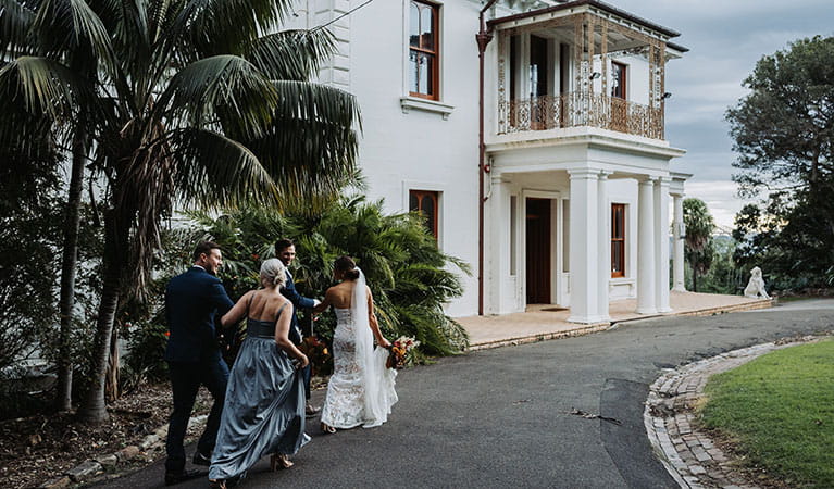 A wedding party walking up the road towards Strickland House in Sydney Harbour National Park. Photo &copy; Matt Horspool