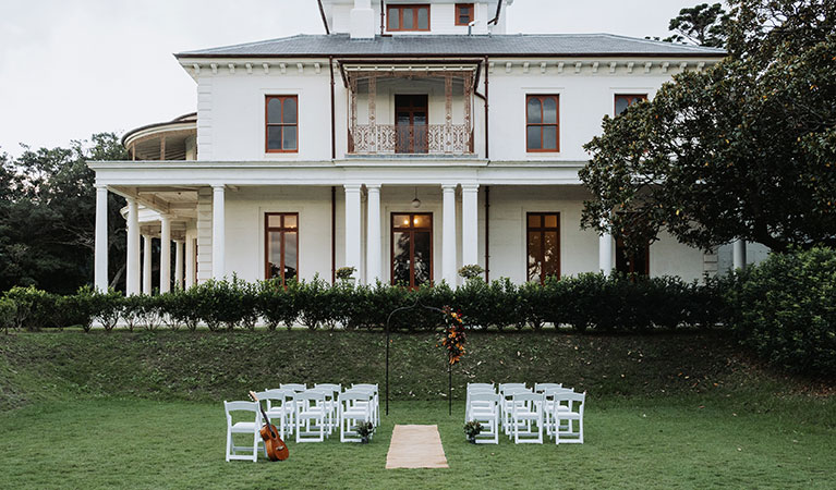 Chairs set up on the lawn at Strickland Estate with Strickland House in the background in Sydney Harbour National Park. Photo &copy; Matt Horspool