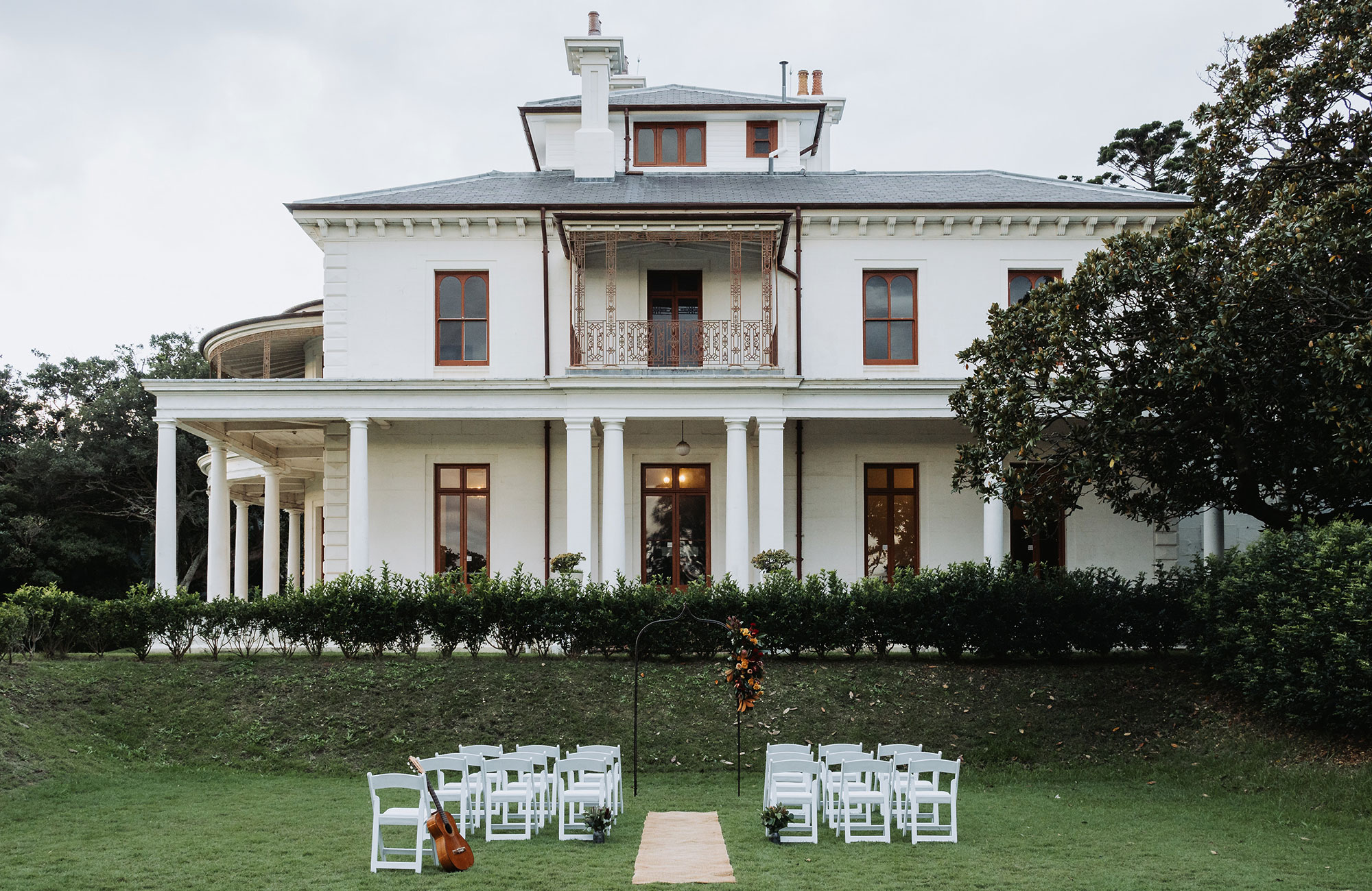Chairs set up on the lawn at Strickland Estate with Strickland House in the background in Sydney Harbour National Park. Photo &copy; Matt Horspool