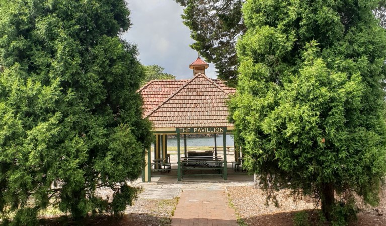 The Pavillion picnic shelter through trees in Ku-ring-gai Chase National Park. Photo: Nicole Ribera &copy; OEH