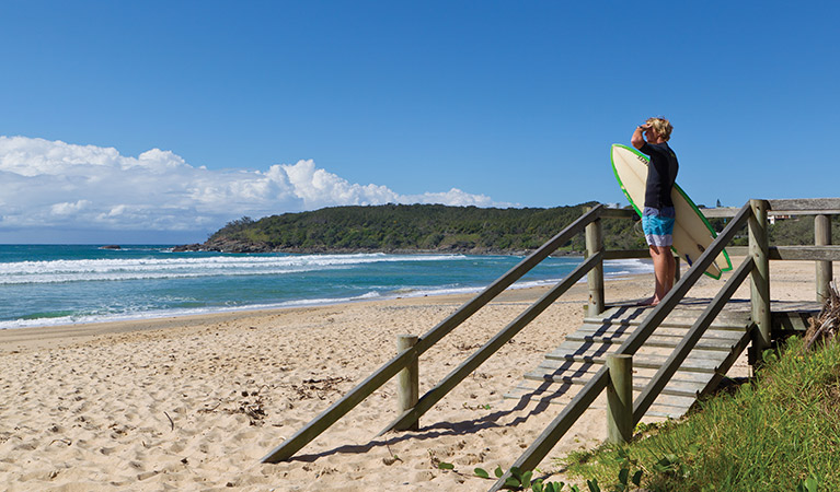 Surfer at Ocean View Beach, Coffs Coast Regional Park. Photo: Rob Cleary