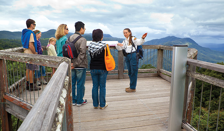 Volunteer guides visitors through the Skywalk lookout, Dorrigo National Park. Photo: Rob Cleary/Seen Australia