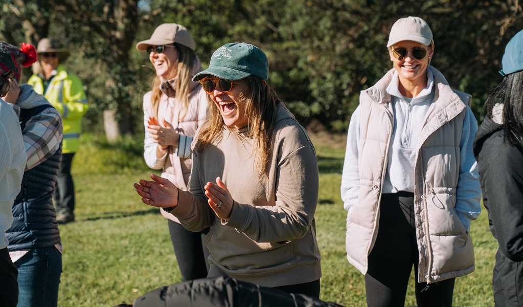 Volunteers cheer each other on during games at Middle Head, Sydney Harbour National Park. Credit: Remy Brand/DCCEEW &copy; the photographer