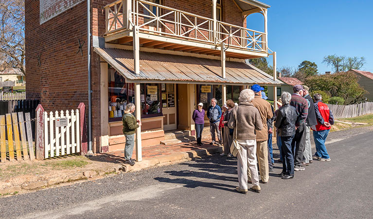 Visitors take a guided tour in Hill End Historic Site. Photo: John Spencer